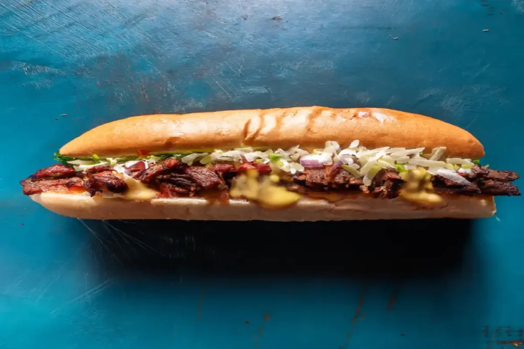 What type of roll is used for a Philly cheesesteak?